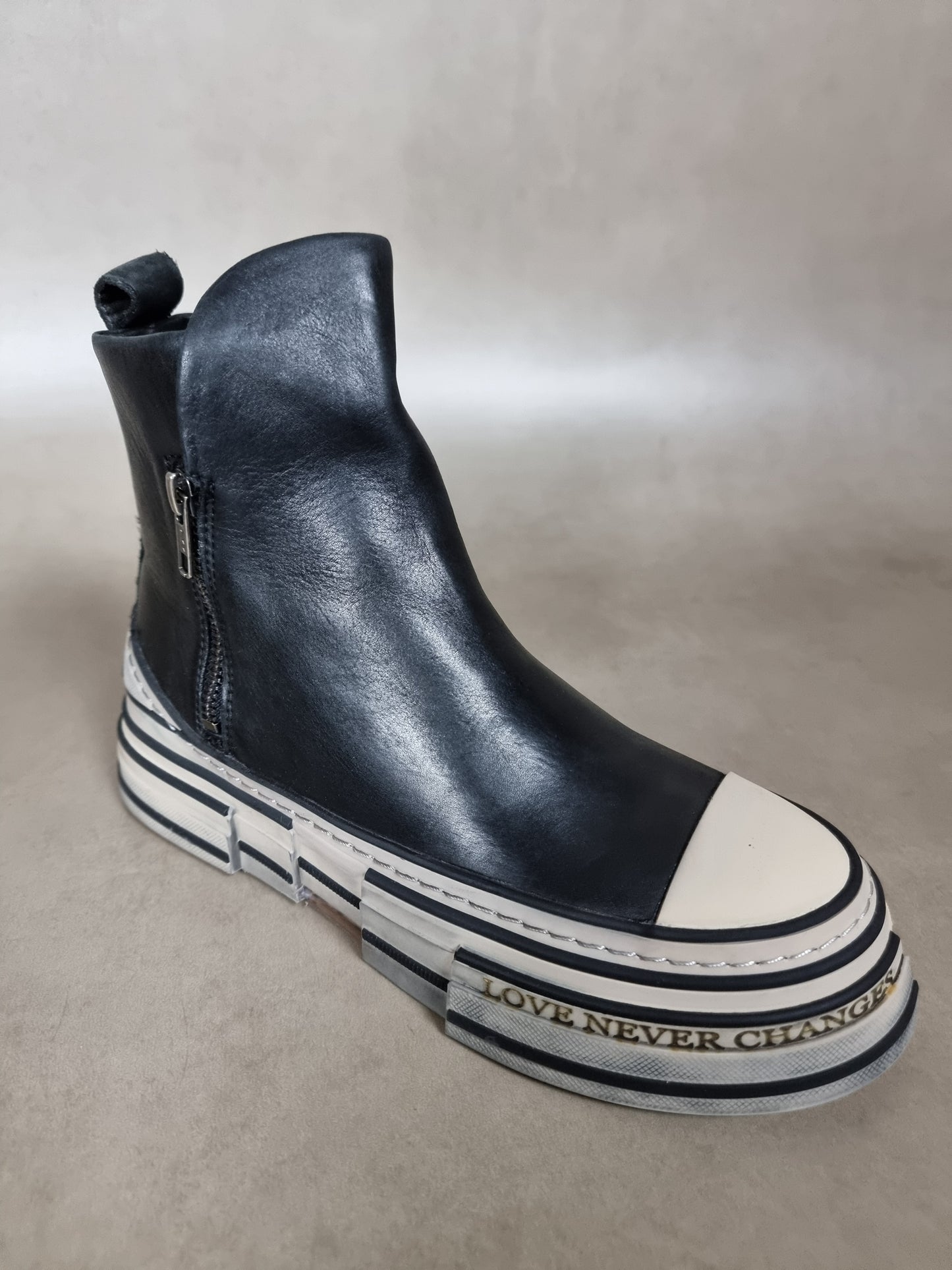 ankle boot with zip and striped bottom